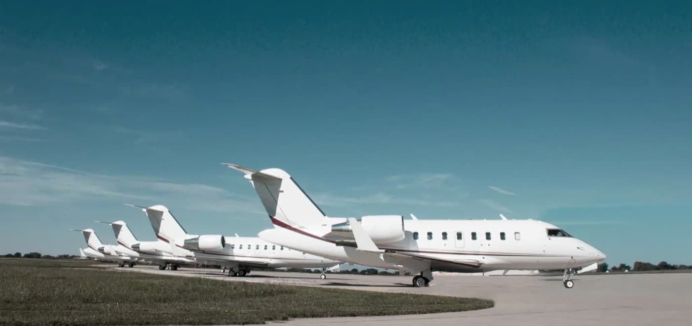 A lineup of Leviate-managed private jets on the tarmac