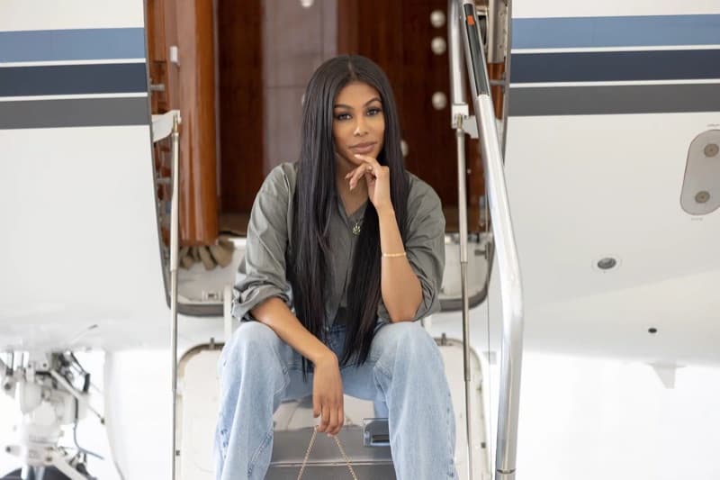 A client seated on the airstair of a private jet