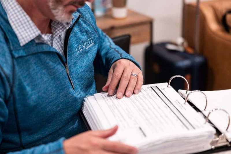 A Leviate advisor reviewing aircraft documents