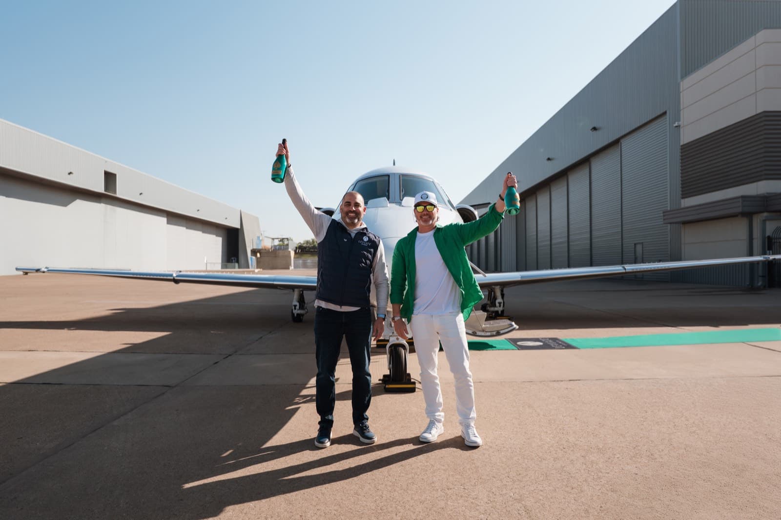 Team members celebrating on the tarmac