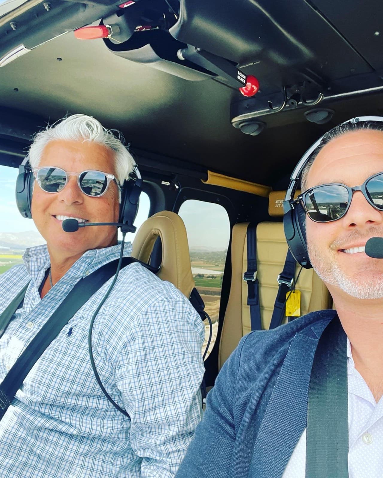 Teammates in the cockpit of a helicopter