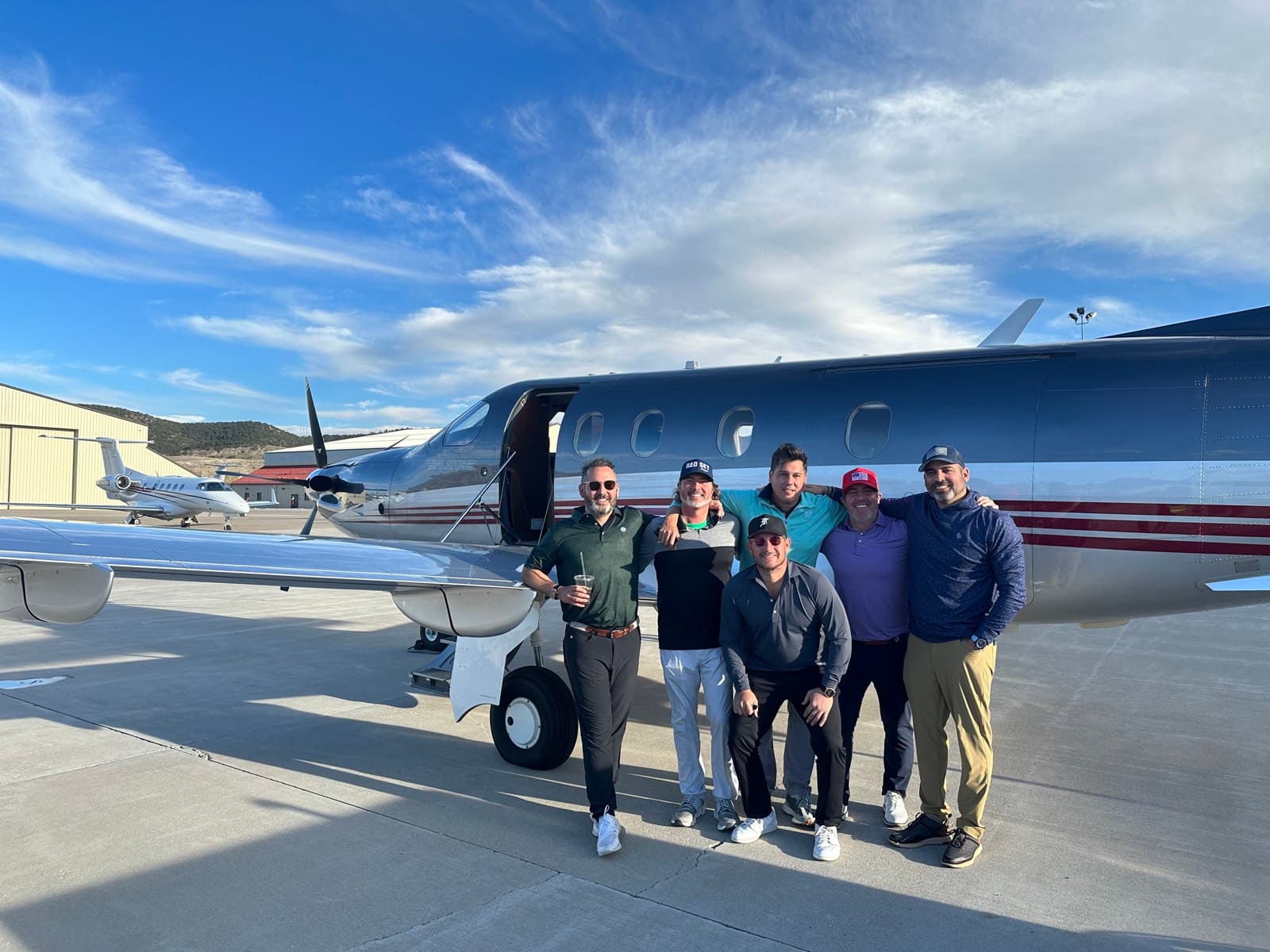 The Leviate team on the ramp beside a private jet